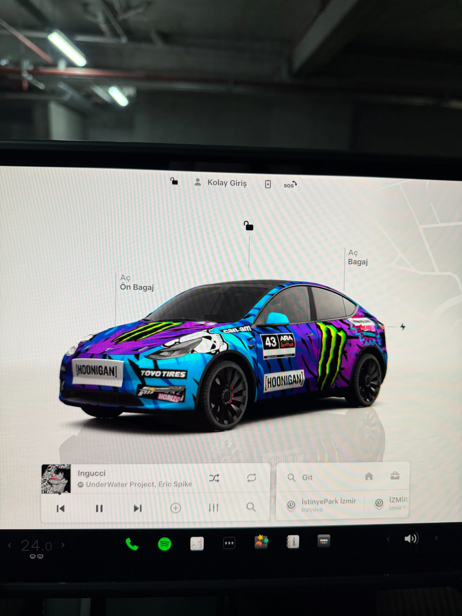 Tesla vehicle screen showing full custom Hoonigan wrap display
